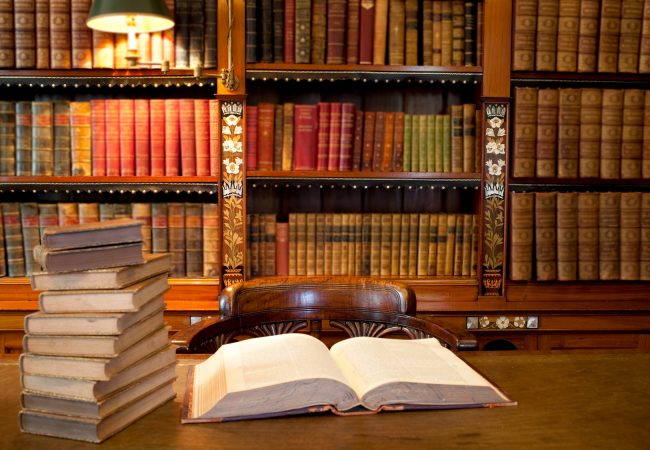 Old classic library with books on table Old classic library with books on table